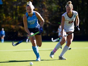 UNC first-year forward Ryleigh Heck (12) chases the ball during UNC's match against Saint Joseph's on Sunday, Nov. 13, 2022. UNC won 5-2.
