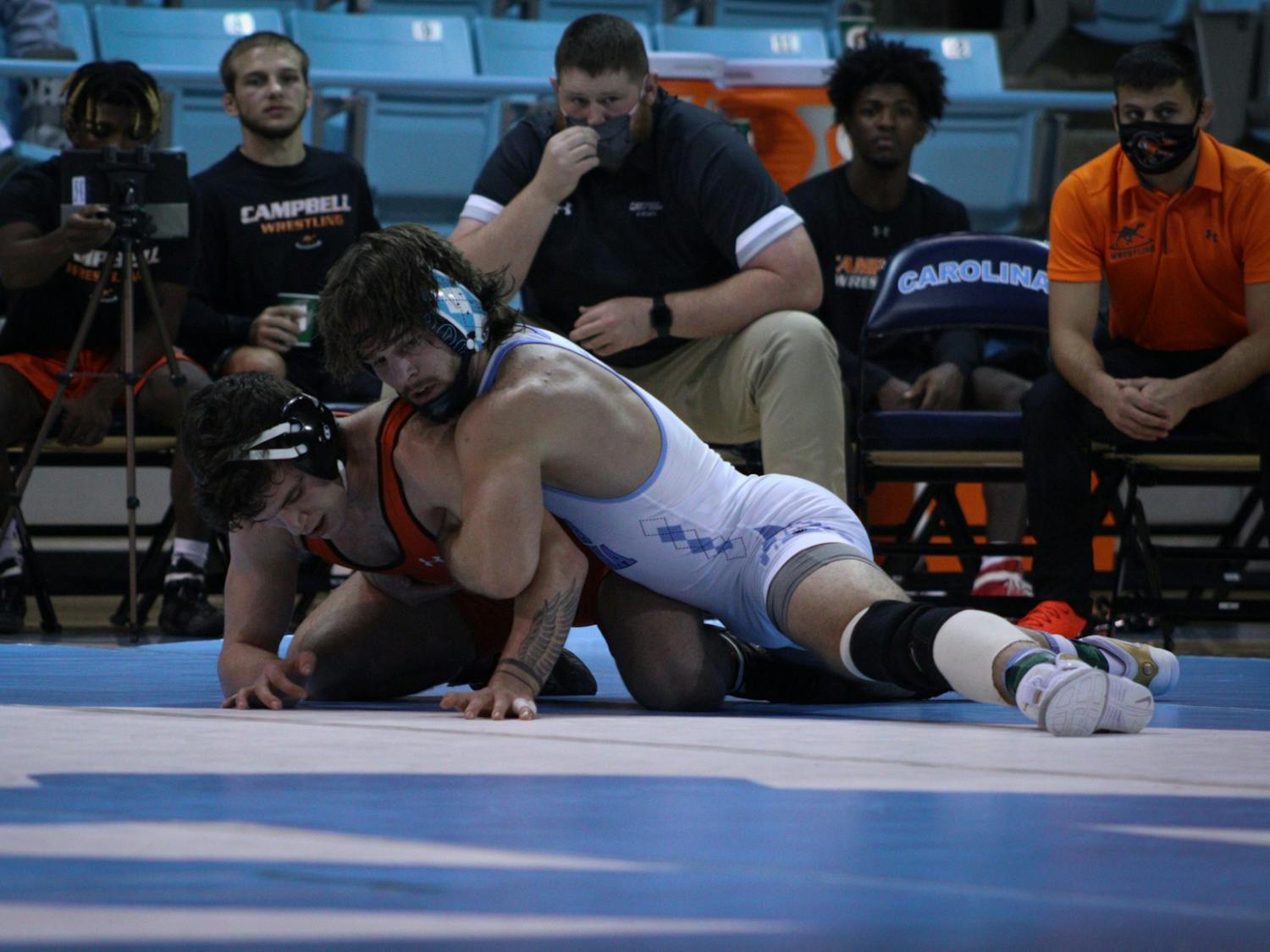 No. 2 redshirt senior Austin O'Connor, defending national champion, pins his opponent to win a match against a Campbell University opponent on Sunday, Nov. 21, 2021. UNC wrestling beat Campbell 24-12.