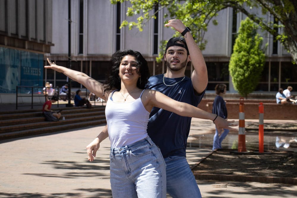 <p>UNC sophomore English major Luisa Peñaflor and senior pre-med student Michael Kane perform in The Pit as a part of the UNC Latin dance group Qué Rico on Monday, April 17, 2023. Qué Rico will have a show on April 23 at 7 p.m. in the Great Hall of Frank Porter Graham Student Union, and it will be the first large-scale Latin dance show at UNC.</p>
