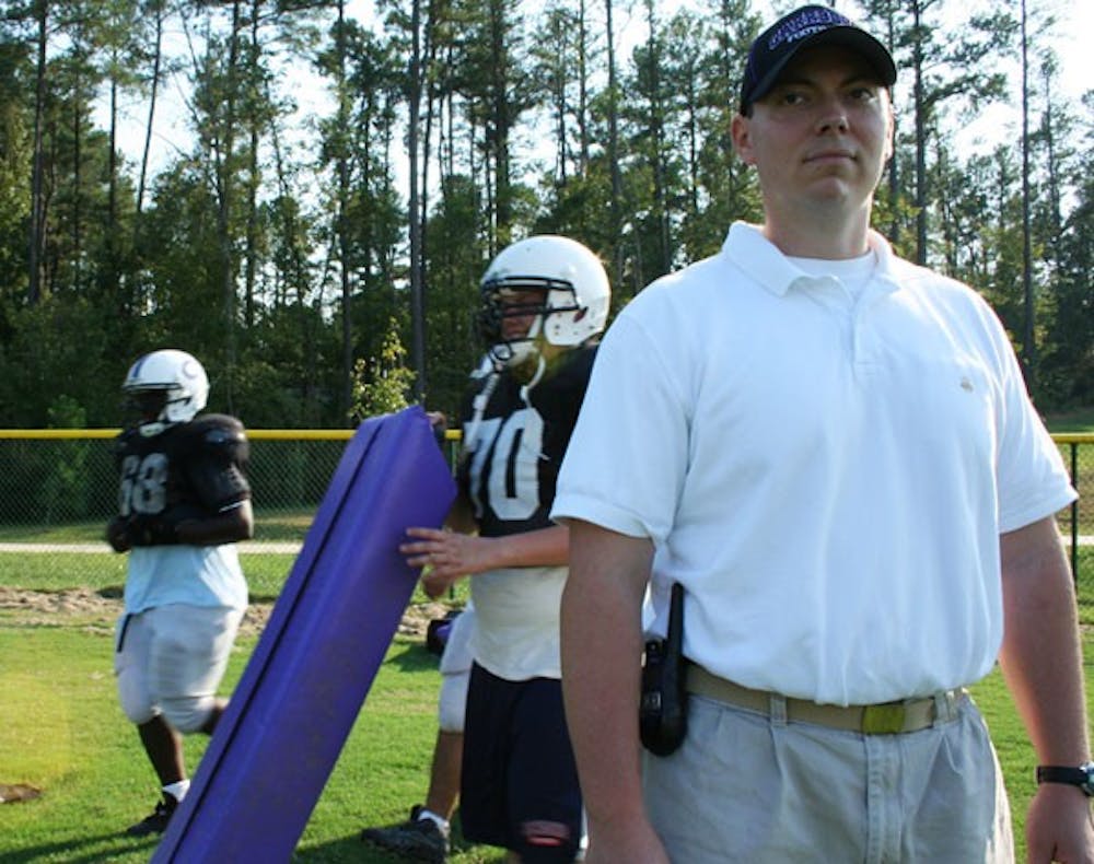 Tommy Barr, Carrboro High School’s new full-time athletic trainer, observes the players Monday afternoon. DTH/Laura Melosh