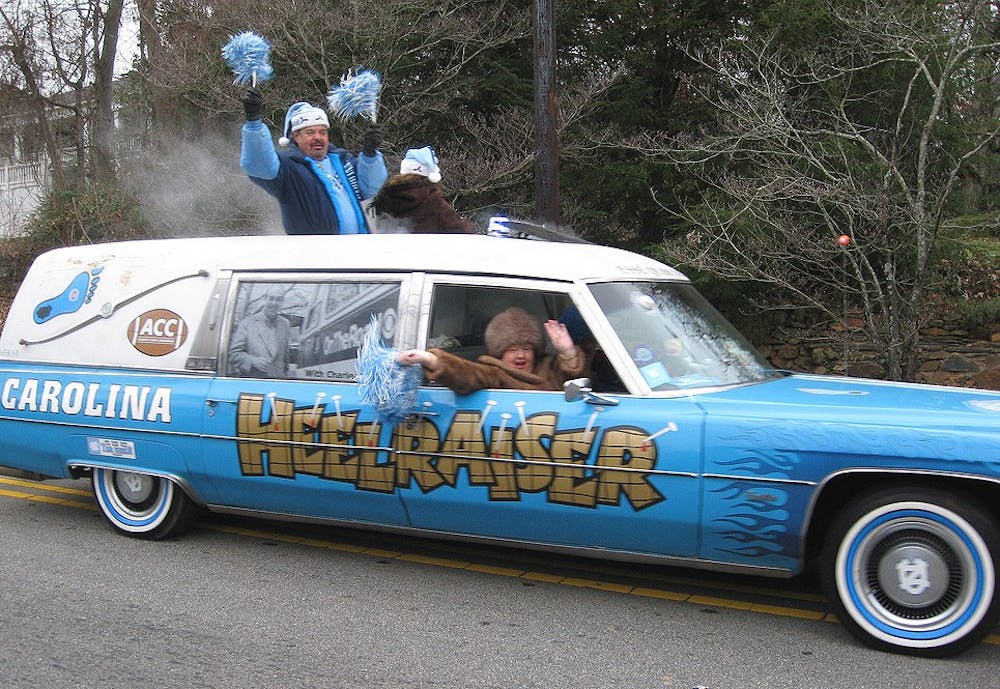 	<p>John Snipes riding in his car the Heelraiser in the Hillsborough Christmas Parade.</p>