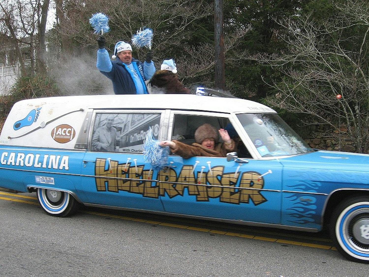 	John Snipes riding in his car the Heelraiser in the Hillsborough Christmas Parade.