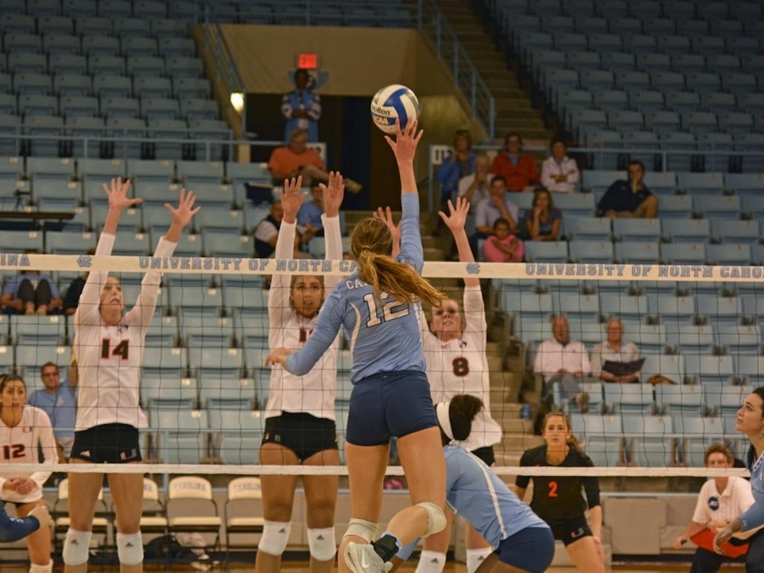 Julia Scoles (12) attacks against Miami during her first-year campaign in October 2016.