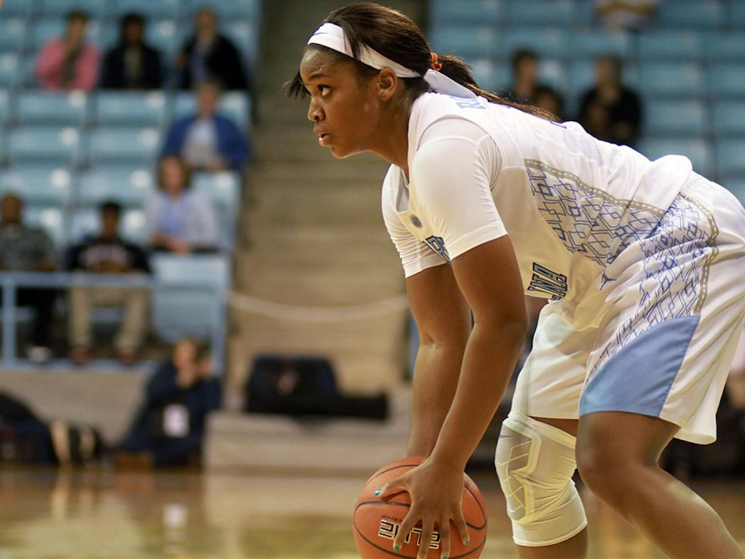 Senior guard Brittany Rountree looks around defenders during the tar heel's first exhibition game of the season.