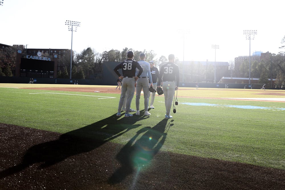 <p>Several members of the UNC baseball team speak to Head Coach Scott Forbes during a practice on Wednesday, Jan. 26, 2022.</p>