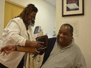 Eddie Caldwell has his blood pressure taken before an appointment at the Inter-Faith Council Community Health Center in Chapel Hill, NC, on Tuesday afternoon.