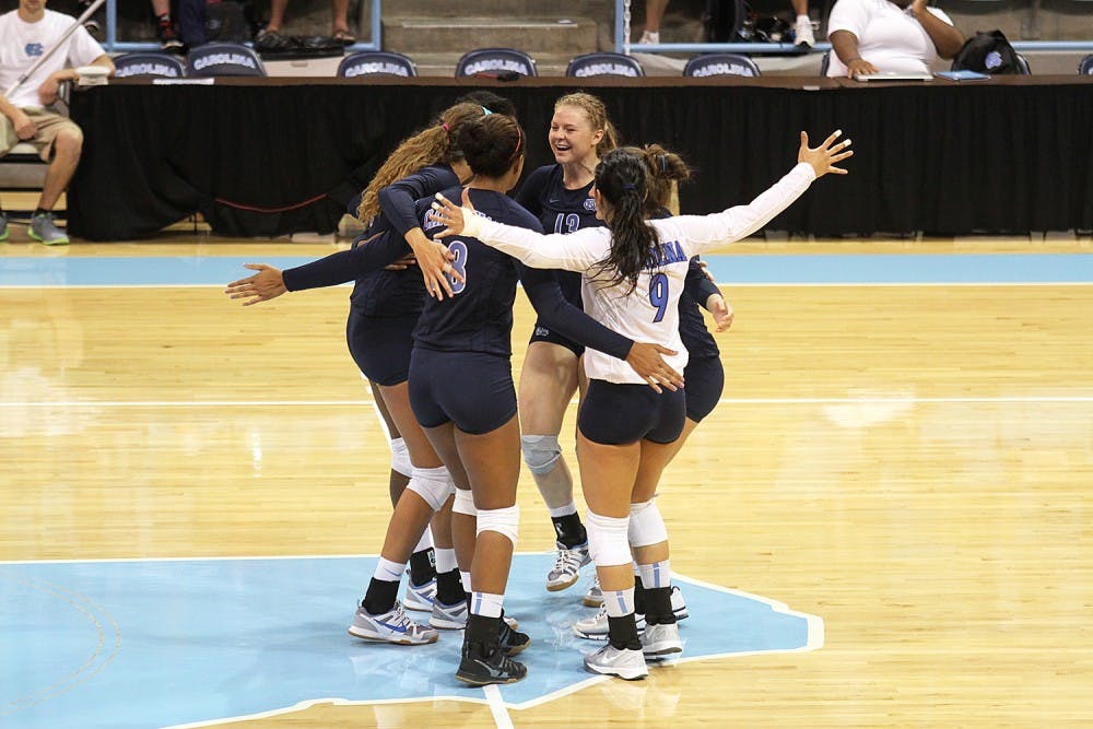 UNC's volleyball team embrace between plays during their match again Georgia Southern Saturday.  They would go on to win 3-0.
