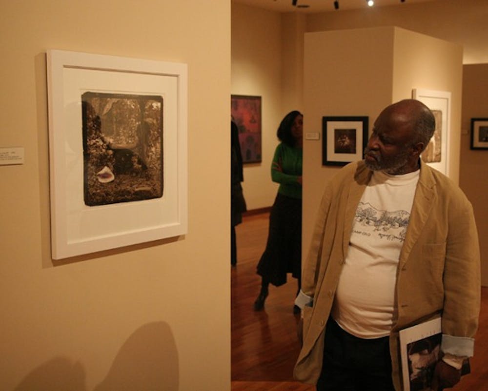 Bill Jenkins, an epidemiologist at the Institute of African American Research, views the gallery Thursday. DTH/Sam Ward