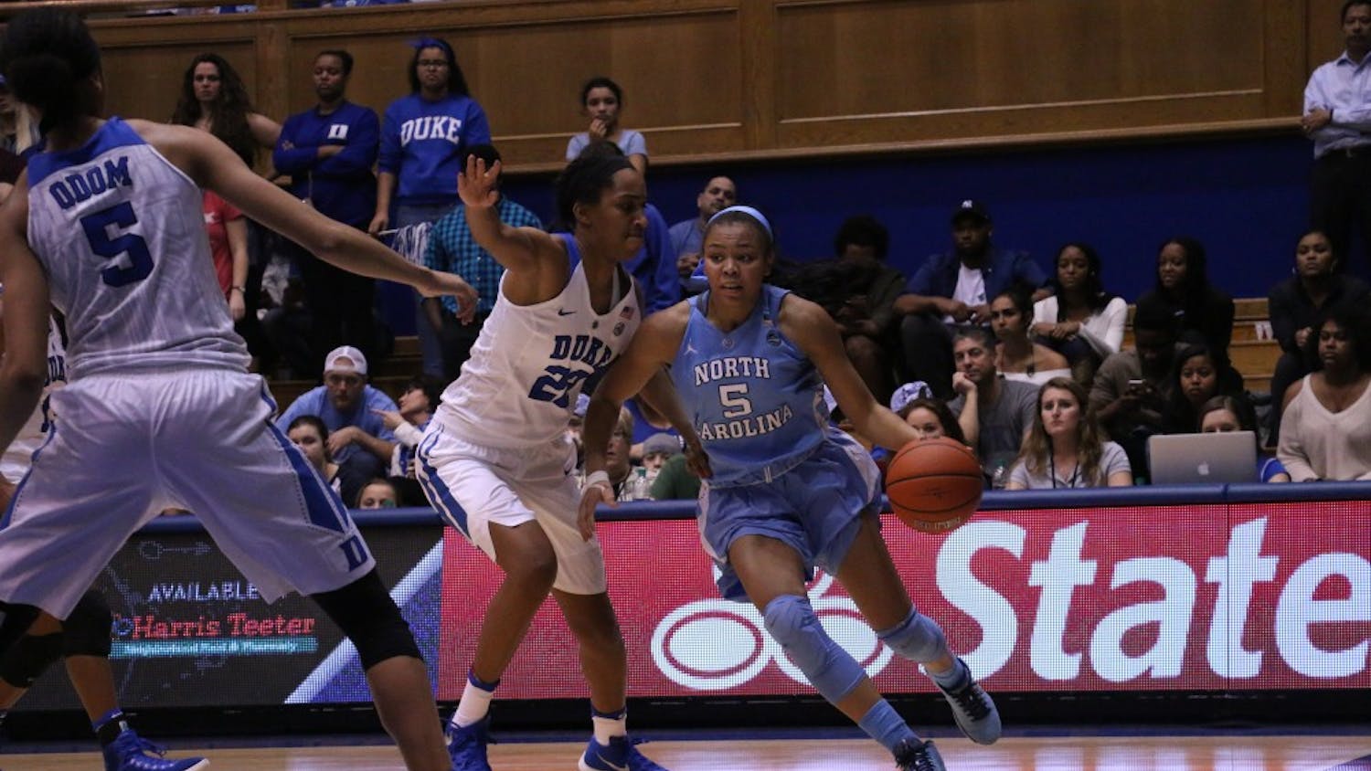 UNC sophomore guard Stephanie Watts (5) dribbles along the baseline at Cameron Indoor Stadium. The Tar Heels lost 70-58 to No. 12 Duke on Thursday.