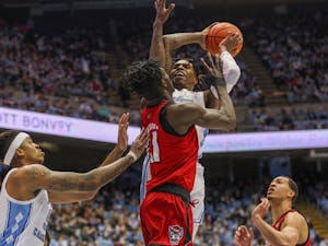 UNC sophomore guard Caleb Love (2) shoots the ball at the North Carolina State University game on Saturday Jan. 29, 2022 at the Smith Center in Chapel Hill. UNC won 100-80.