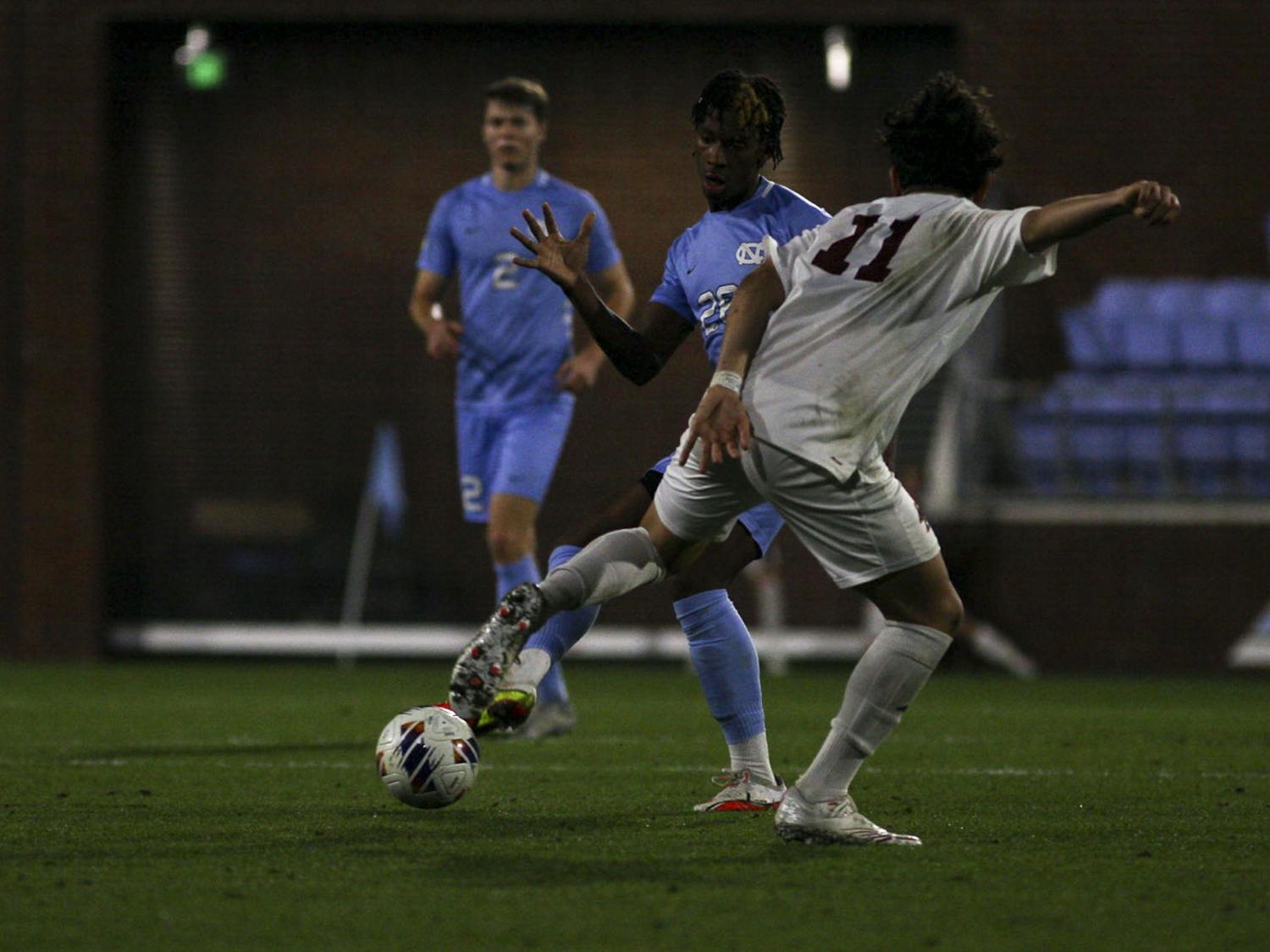 UNC junior midfielder/forward Ernest Bawa (20) defends the ball during the men's soccer against Boston College at Dorrance Field on Wednesday, Nov. 2, 2022. UNC beat Boston College 1-0.