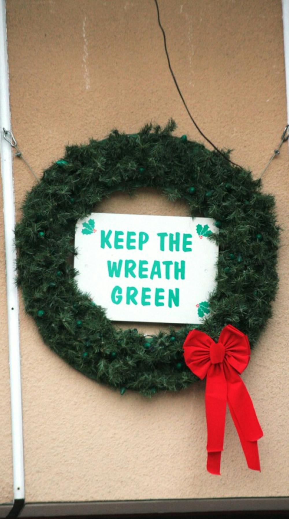 The wreath which hangs above Fire Station Number 1 serves as both a festive display and a fire safety reminder, as one of the wreath’s lights turns from green to red for every residential fire in Chapel Hill.
