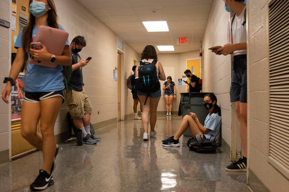 Students move from class to class in Dey Hall on Aug. 30, 2021. As UNC returns to in-person learning, it seems they've reverted the attendance policy---students again have to prove illness or a family situation that falls under University Approved Absence guidelines in order to miss class without penalty.