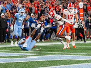 UNC junior wide receiver Josh Downs (11) slides into the end zone during the 2022 Subway ACC Football Championship Game against Clemson at the Bank of America Stadium on Saturday, Dec. 3, 2022. UNC fell to Clemson 39-10.