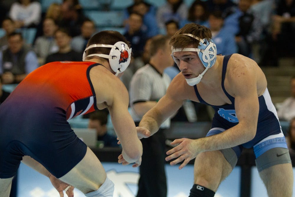 Redshirt sophomore Austin O'Connor watches his opponent, Bucknell junior Matthew Kolonia in Carmichael Arena on Satuday, Feb. 1, 2020. The Tar Heels won 25-9.