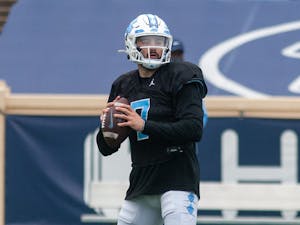 Sophomore quarterback Sam Howell (7) prepares to throw the ball at the football practice on Saturday Mar. 27, 2021 at Kenan Stadium.