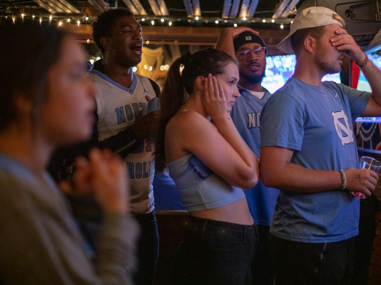 Students react to the NCAA Championship game in Goodfellows on Monday, April 4, 2022. "It was frustrating to go into the second half with such a solid lead and see that go away," said Caroline Perez, a UNC senior wathcing the game at Goodfellows.  "Ultimatley, I am very proud of how our team did given many predicted we were not even going to make the tournament. "