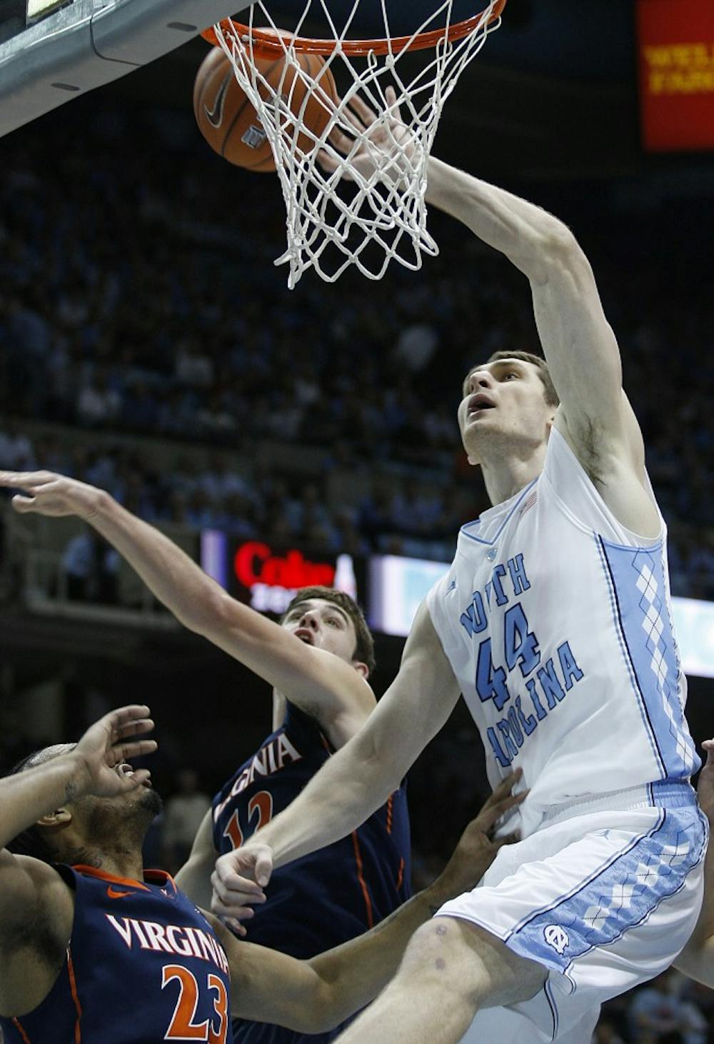 UNC forward Tyler Zeller takes the ball to the hoop during the first half of the game against the Virginia Cavaliers on Saturday. Zeller led the Tar Heels in scoring with 25 points in the 70-52 win over the Cavaliers. 