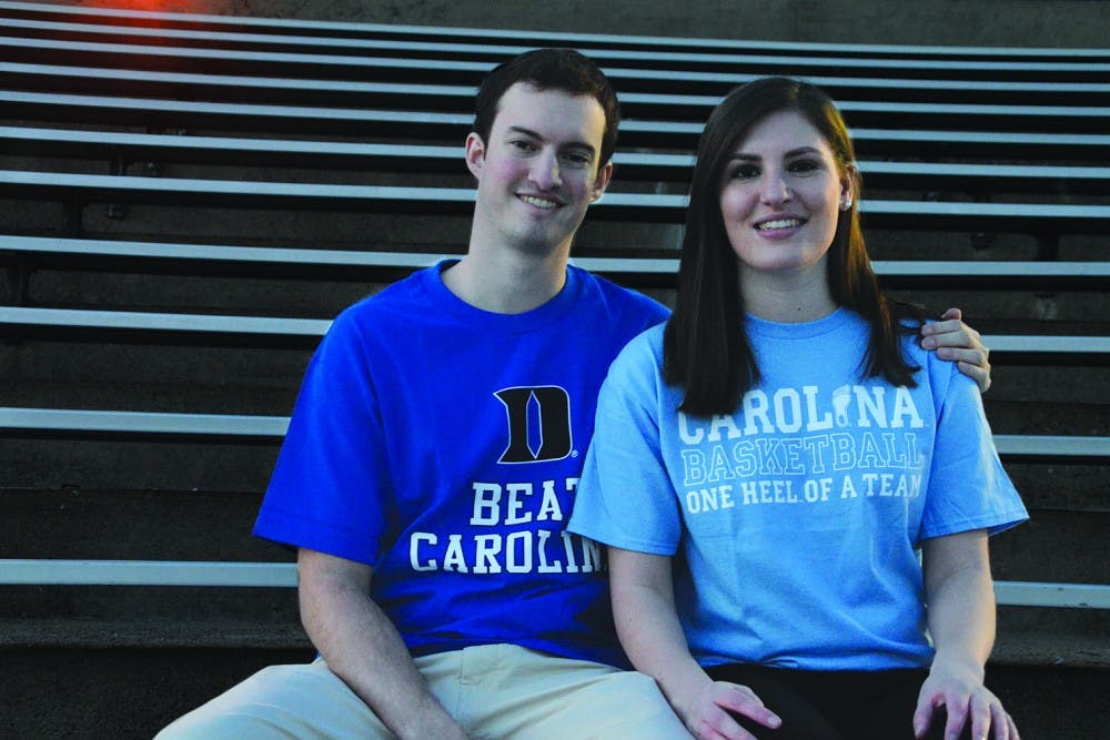 Stephanie DeFazio, a senior, and Joe Hendricks, a first-year law student at Duke University, on the bleachers at Fetzer Field. DeFazio and Hendricks met at He's Not Here in September.