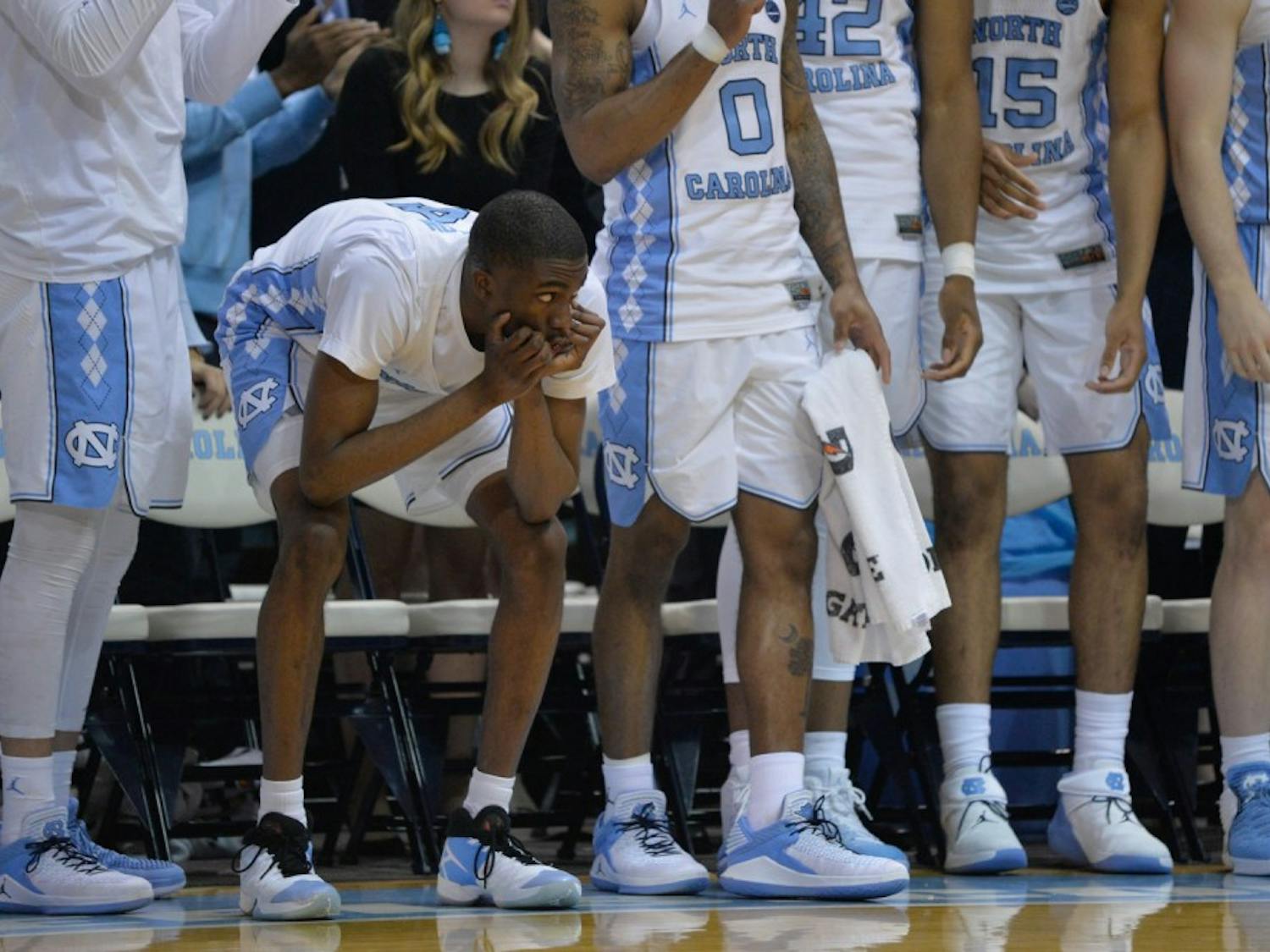 Sophomore guard Brandon Robinson (4) watches the second half anxiously from the bench on Feb. 27 at the Smith Center.