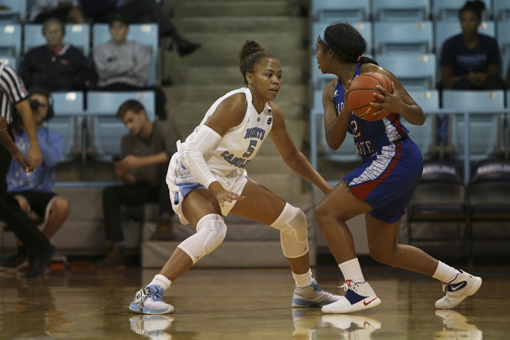 Sophomore guard Stephanie Watts (5) defends during the game against Elizabeth City State at Carmichael Arena on Monday.