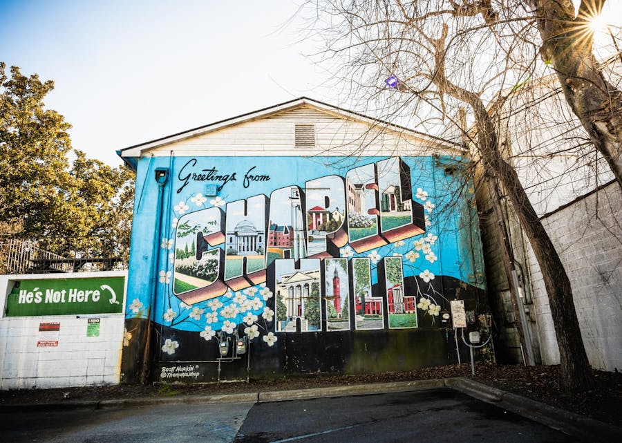 He's Not Here postcard mural sends visitors lasting scenes of Chapel Hill's charm