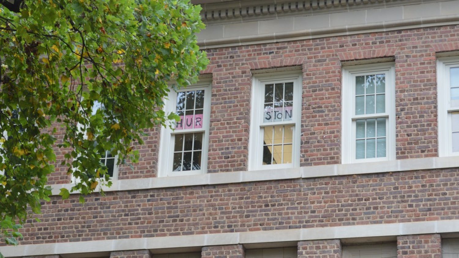 Professor Altha Cravey's third-floor office window displays a sign reading "Hurston" in the recently renamed Carolina Hall.
