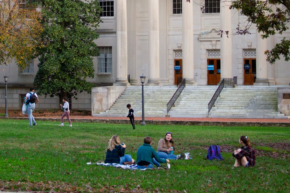 Students gather on the quad, socially distanced, in front of Wilson Library on Saturday, Nov. 14, 2020.