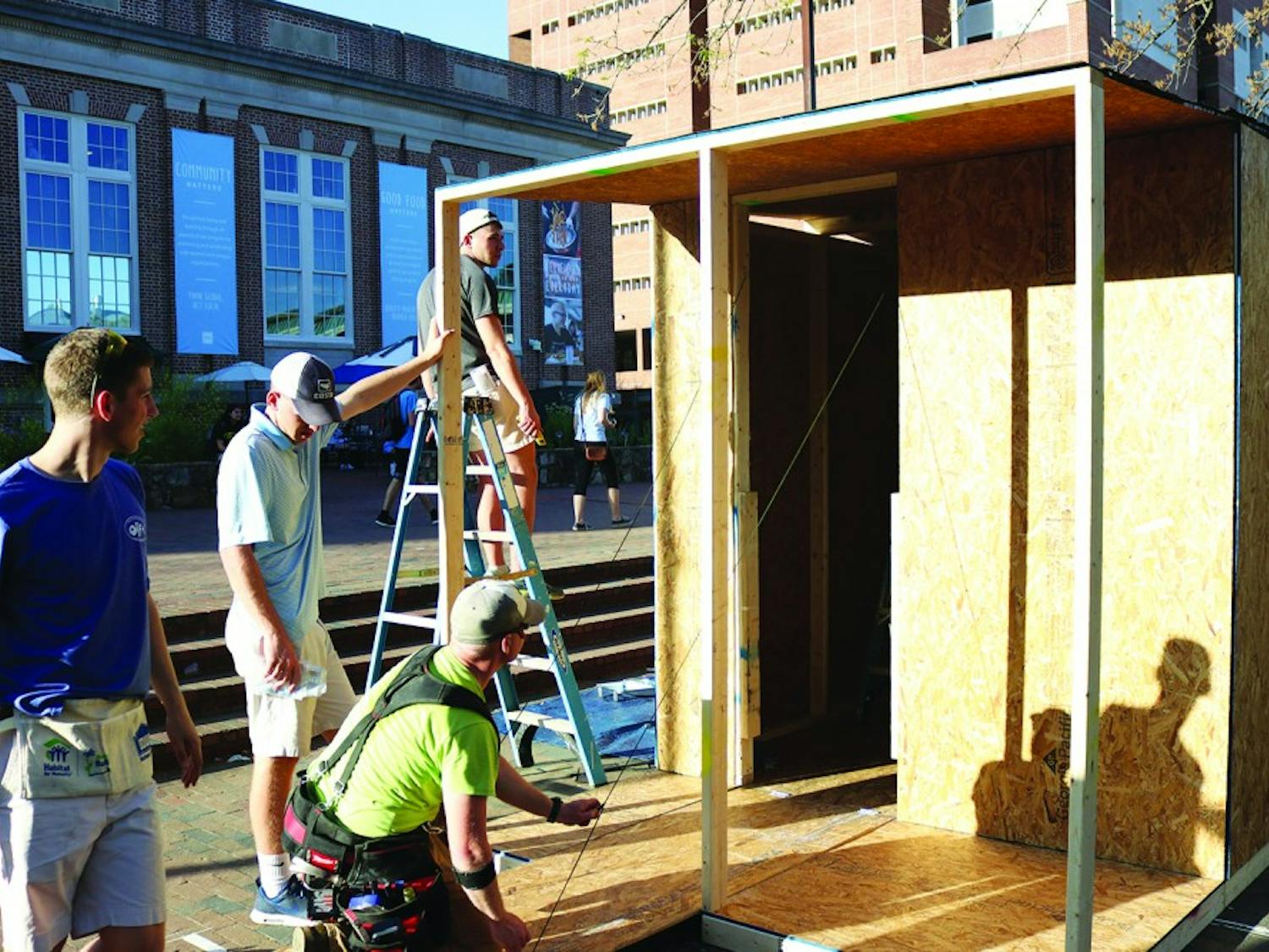 Romeo Antolini (left), Chase Jarvis, Staff Sgt. Christopher Brantley and Riley Head build a shack in the Pit for Carolina Blueprint, a weeklong fundraiser.