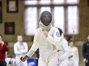 UNC's Sydney Persing fences with Boston College's Vivian Li during the women's fencing match in Card gym at Duke University on Sunday, Feb. 10 2018.