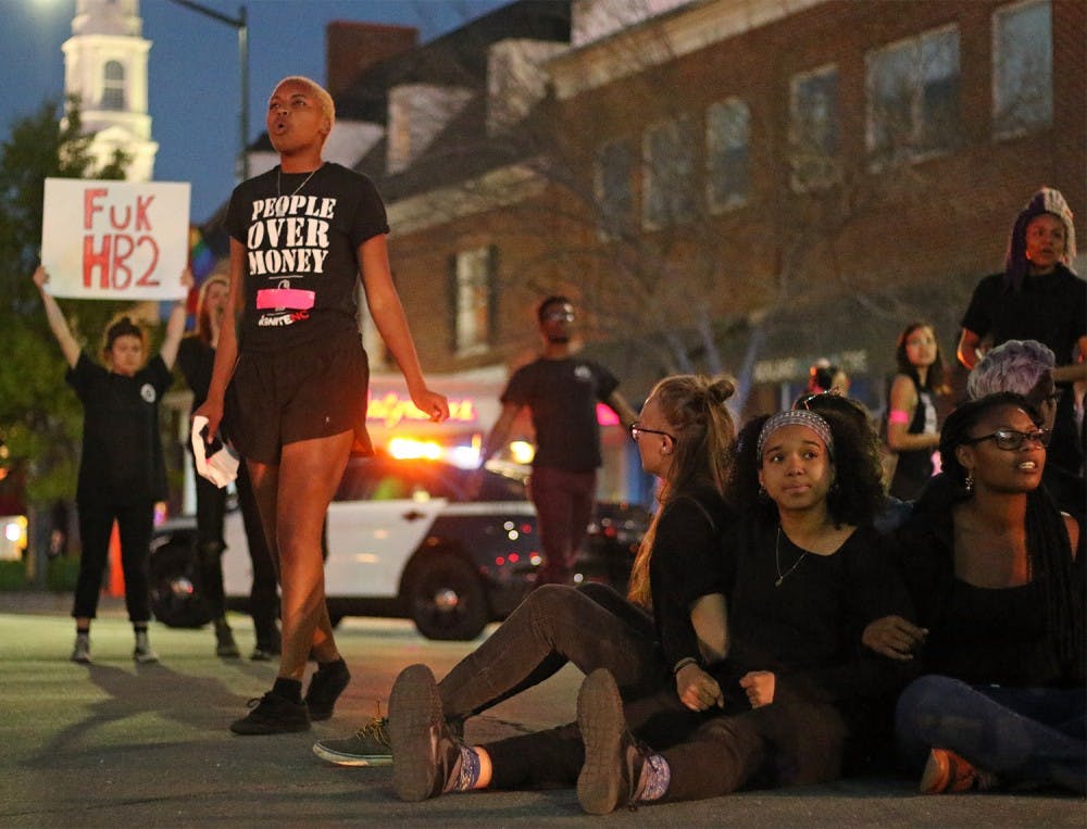 <p>On-campus activist groups centered around people of color and queer/transgender advocacy shut down the intersection of Franklin St. and Columbia St. on Mar 29, 2016 in protest of newly passed House Bill 2.</p>