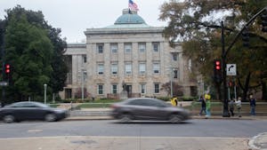 Cars pass by the North Carolina State Capitol building on Friday, Nov. 13, 2020. In the 2020 election, all of the incumbents in the council of state races won re-election or are leading over their opponent.