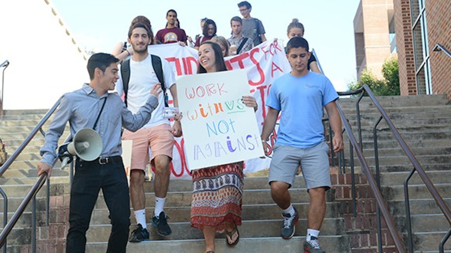 Members of the Students for a Democratic Society march together protesting the Board of Governor's decision against Gender-Neutral housing earlier this year. They marched from the pit to the General Administration building, where the Board of Governors was holding its monthly meeting.