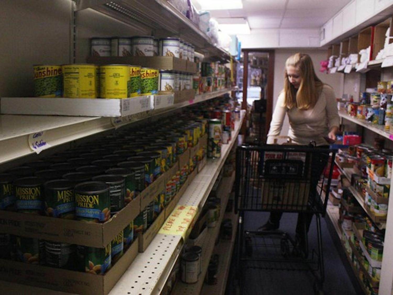 Erin Kabrick makes a meal bag Monday at the Inter-Faith Council for Social Service’s Food Pantry. DTH/Mary-Alice Warren