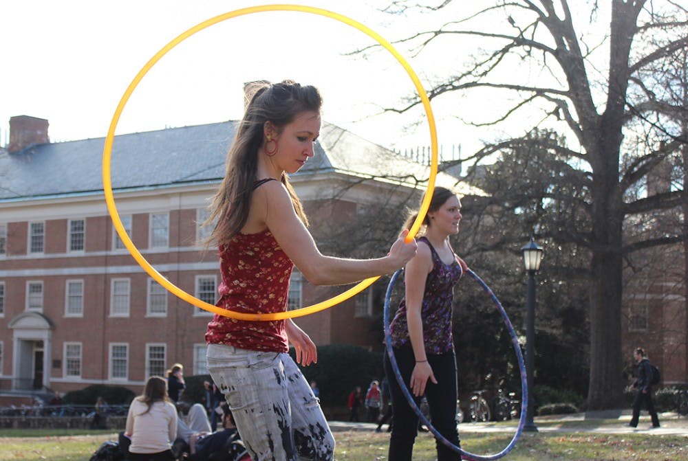 Michelle Swanson, a senior East Asian Studies major, hula hoops in the quad with the Carolina Hula Hoop Club on Monday afternoon. 
