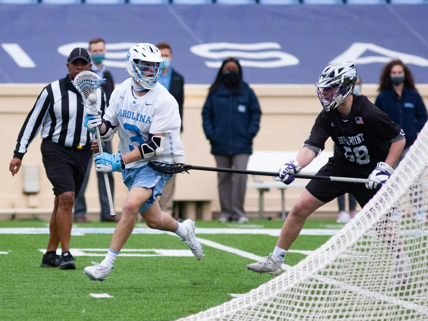 Senior midfielder William Perry (3) looks for an opening. UNC wins against High Point 27-12 at Kenan Stadium on Saturday, Feb. 27, 2021.
