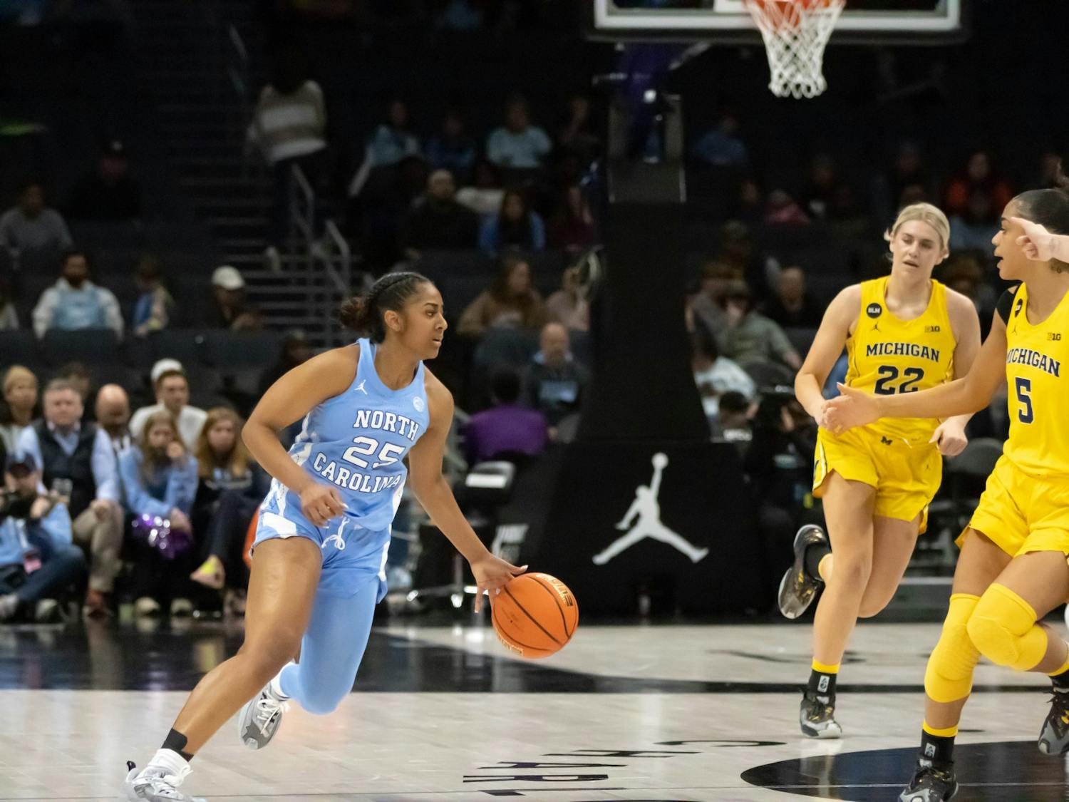 UNC junior guard, Deja Kelly (25), prepares to drive towards the basket during the against Michigan at the Spectrum Center in Charlotte, N.C., on Tuesday, Dec. 20, 2022. UNC fell to Michigan 76-68.