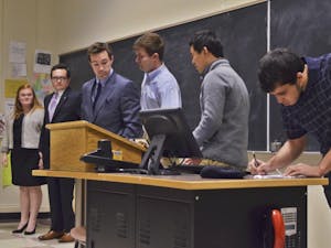 The democratic candidates for student body president stand before the Young Democrats Debate on Monday night.