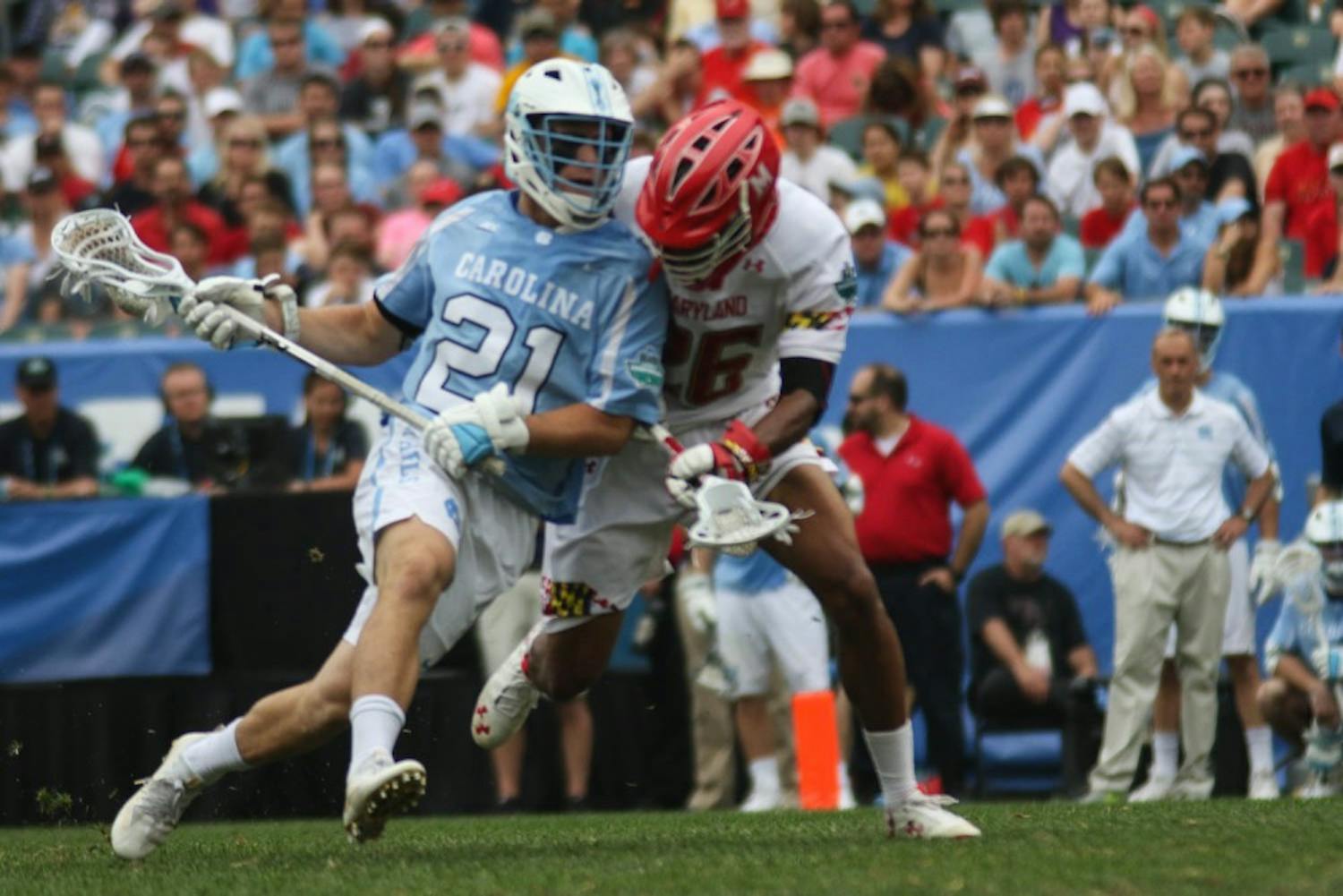 UNC midfielder Michael Tagliaferri (21) fights off a Maryland defender. The unseeded North Carolina men's lacrosse team defeated No. 1 Maryland 14-13 in overtime to claim the program's first national championship since 1993 in May&nbsp;at Lincoln Financial Field in Philadelphia. North Carolina faces Maryland this Saturday at 11:30.&nbsp;