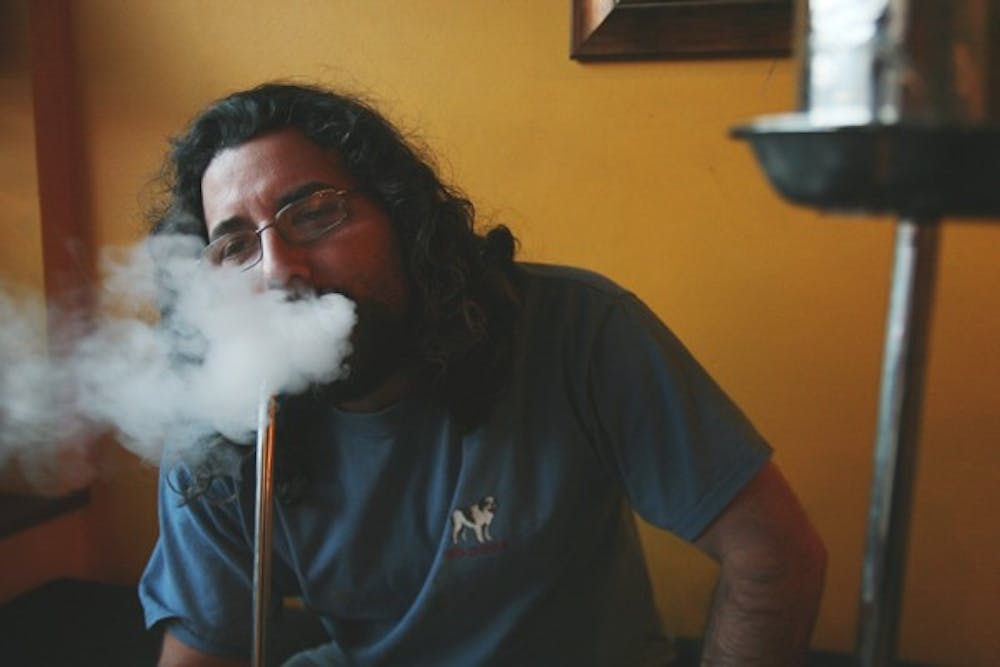 Adam Bliss, owner of Hookah Bliss, is defying legislation and keeping his doors open. DTH/Andrew Johnson