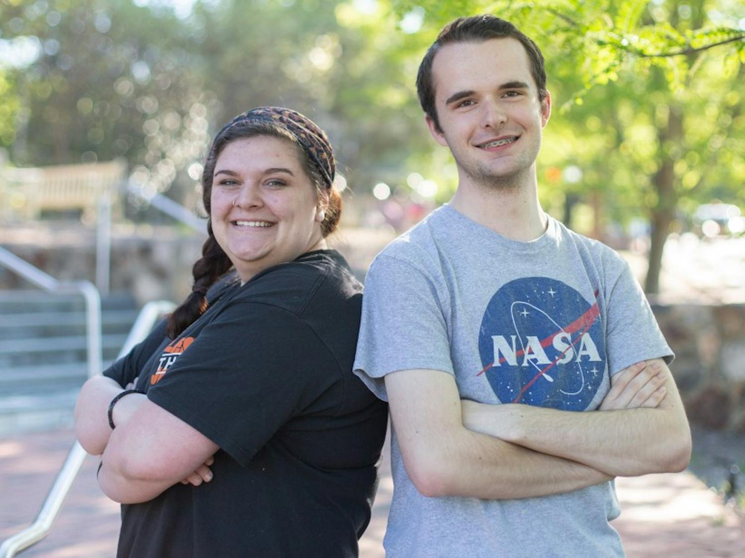 (From left to right) Mallory Ward, senior peace, war, and defense major, and Logan Anderson, first-year global studies major, pose on the steps of the FedEx Global Education Center, April 22, 2019. Ward, who is currently 20-years-old, started college at the same age as Ward who is currently 17-years-old.