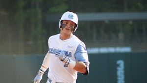 First-year center fielder Vance Honeycutt (7) runs the bases after getting the first home run for UNC of the day. UNC won 10-4 against FSU at home in the second game of the three-game series on Friday, May 20, 2022.