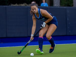 First-year forward Kennedy Cliggett (36) passes the ball at the hockey game against Louisville on Oct. 22 at the Karen Shelton Stadium. UNC lost 2-3 in overtime.