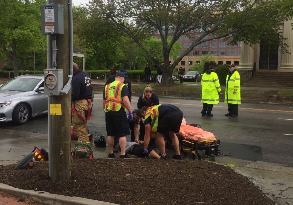 <p>First responders on the scene assessing the injuries of the student.</p>