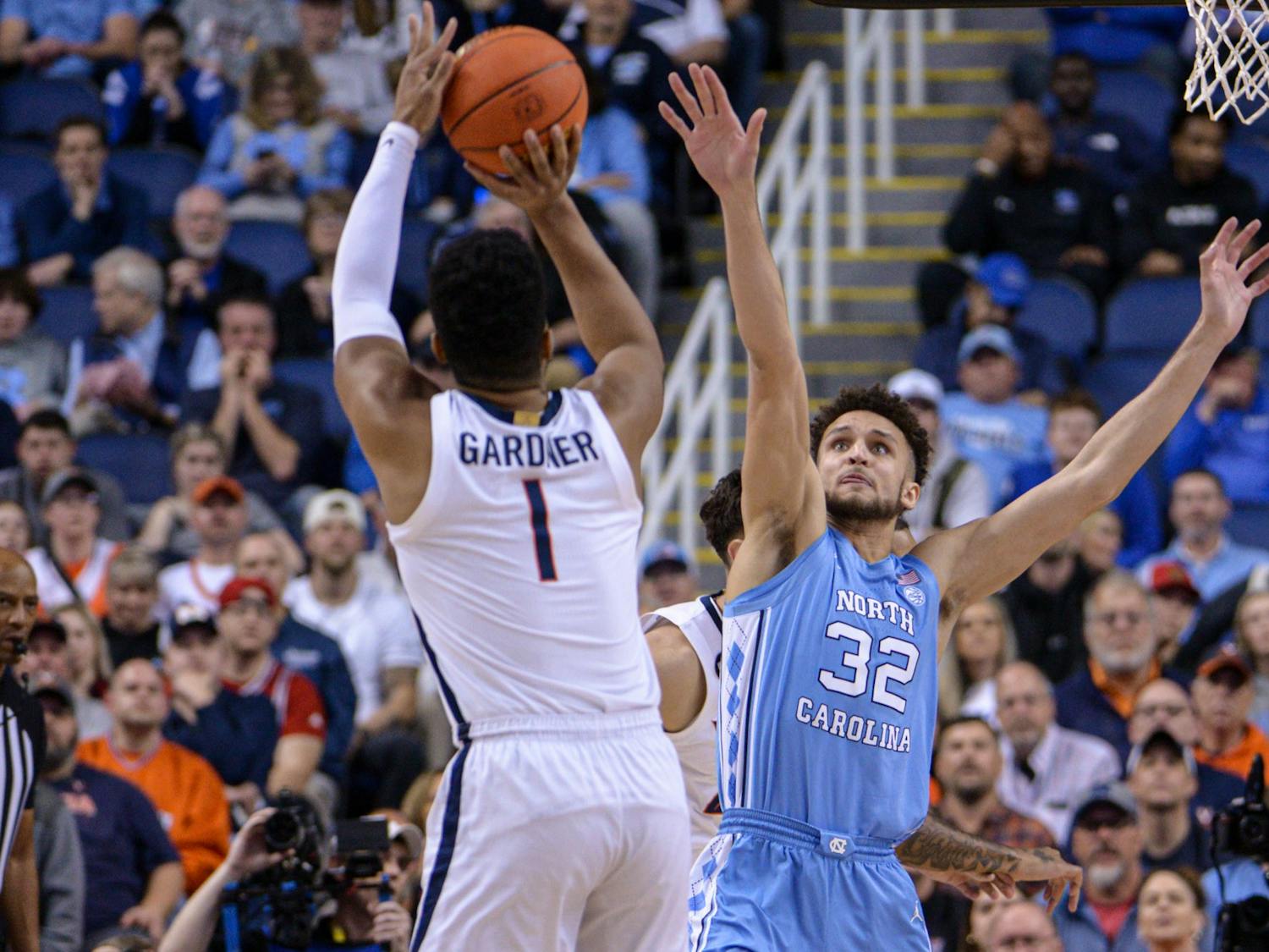 UNC graduate forward Pete Nance (32) defends a 3-pointer during the game against Virginia in the ACC Tournament Quarterfinals at Greensboro Coliseum on March 9, 2023. UNC fell to Virginia 68-59.