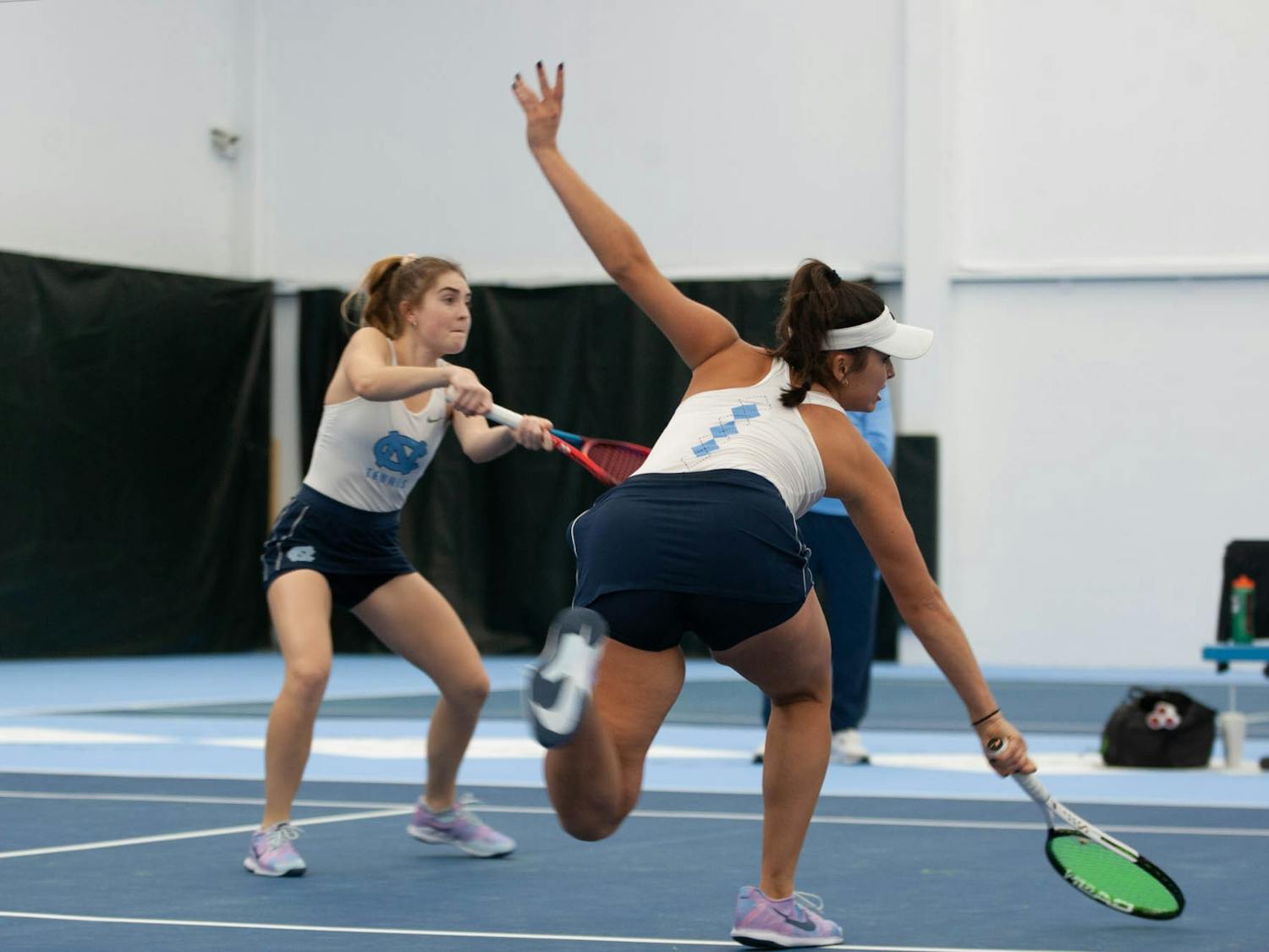 UNC Junior Fiona Crawley and Sophmore Carson Tanguilig return a shot during the Tar Heel 4-0 victory over the Maryland Terrapins in the women's tennis matches on Friday, Jan 27 2023 at The Cone-Kenfield Tennis Center.