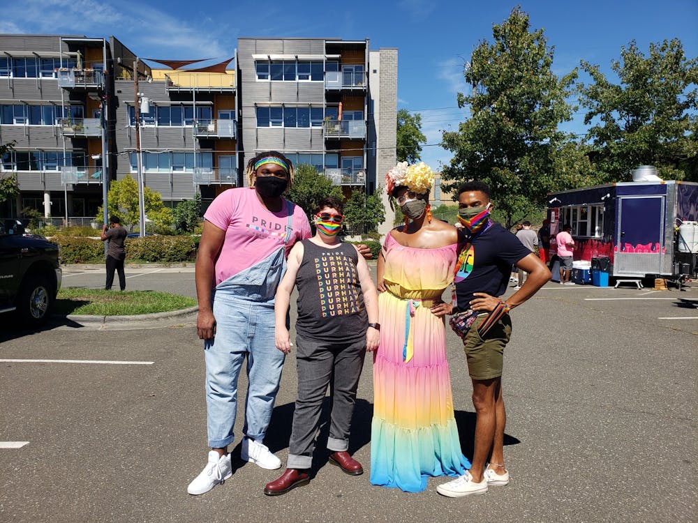 <p>From left to right, LGBTQ Youth Center Program Director Freddy Perkins, Host Home Program Director KC Buchanan, Program Coordinator Hunter and Co-chairperson for Pride: Durham NC Jesse Huddleston celebrate Pride in Durham on Sept. 25.&nbsp;</p>