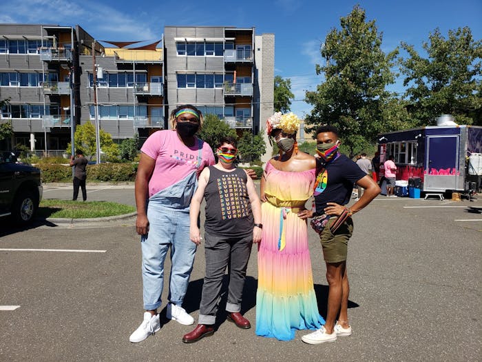 From left to right, LGBTQ Youth Center Program Director Freddy Perkins, Host Home Program Director KC Buchanan, Program Coordinator Hunter and Co-chairperson for Pride: Durham NC Jesse Huddleston celebrate Pride in Durham on Sept. 25.&nbsp;