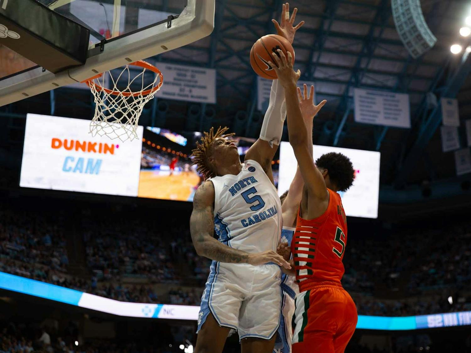 First-year forward Armando Bacot (5) attempts to block a free throw from UM's first-year guard Harlond Beverly (5) in the Smith Center on Saturday, Jan. 25, 2020. UNC defeated Miami 94-71.
