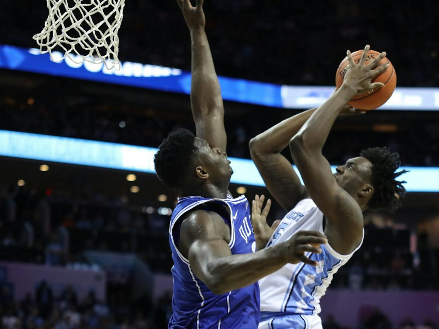 Duke first-year forward Zion Williamson (1) attempts to block a layup by UNC first-year forward Nassir Little (5) during the semifinals of the ACC Tournament at the Spectrum Center in Charlotte, N.C. on Friday, March 15, 2019. UNC fell to Duke 73-74. 